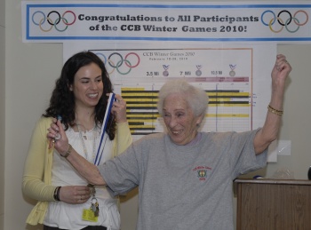 Woman receiving athletic medal - Photo by Mimi Katz